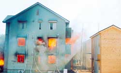 Full-scale burn tests of wooden three-story apartment building
